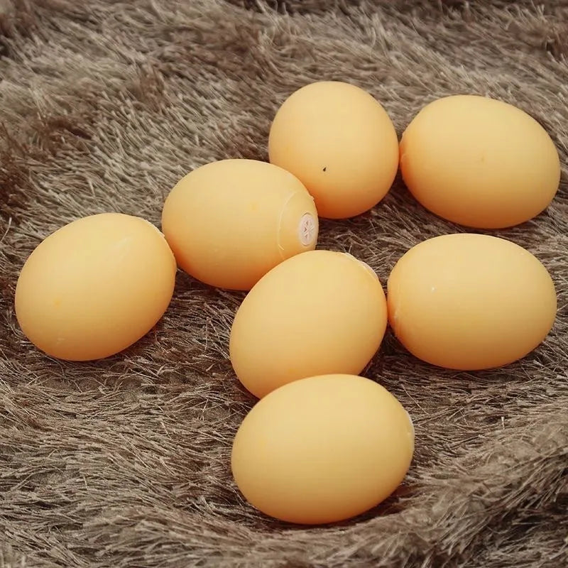 Egg-shaped dog toy with textured surface for tooth cleaning and sound feature