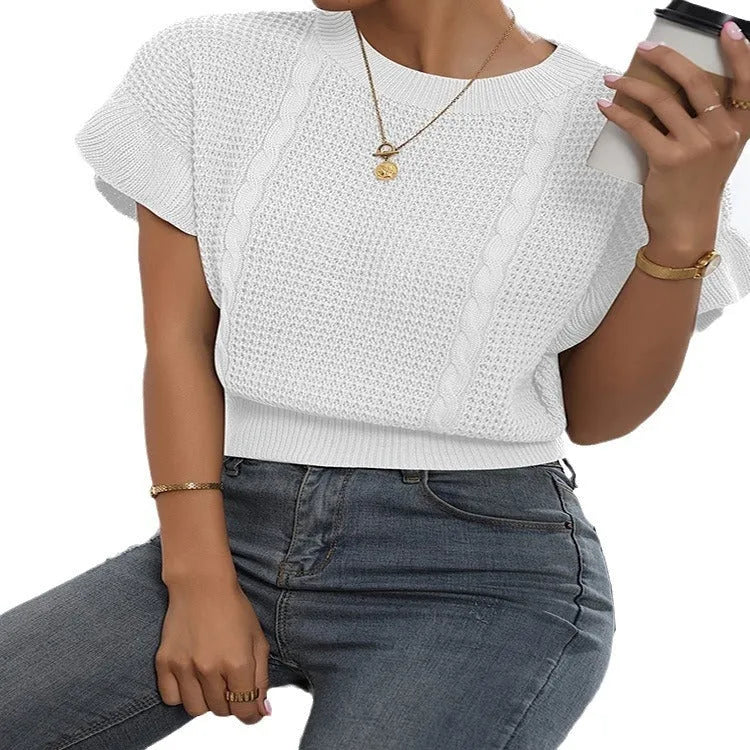 White loose knitted women's pullover sweater with ruffled short sleeves and a textured 3D pattern.
