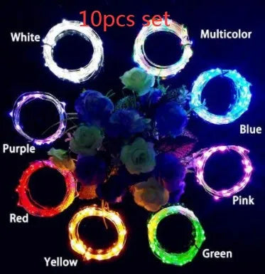 Copper wire LED string light with 20 bulbs and a white plastic bottle stopper for decoration.