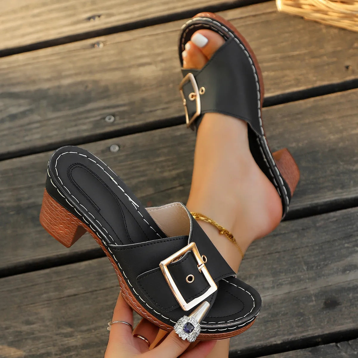 Women's retro chunky heel slippers with metal buckle detail in black or light blue, round head PU upper and rubber sole.