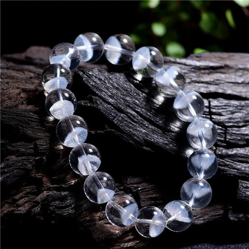 Women's white crystal pyramid bracelet with Ruyi design elements showing pyramid shapes and adjustable sizing