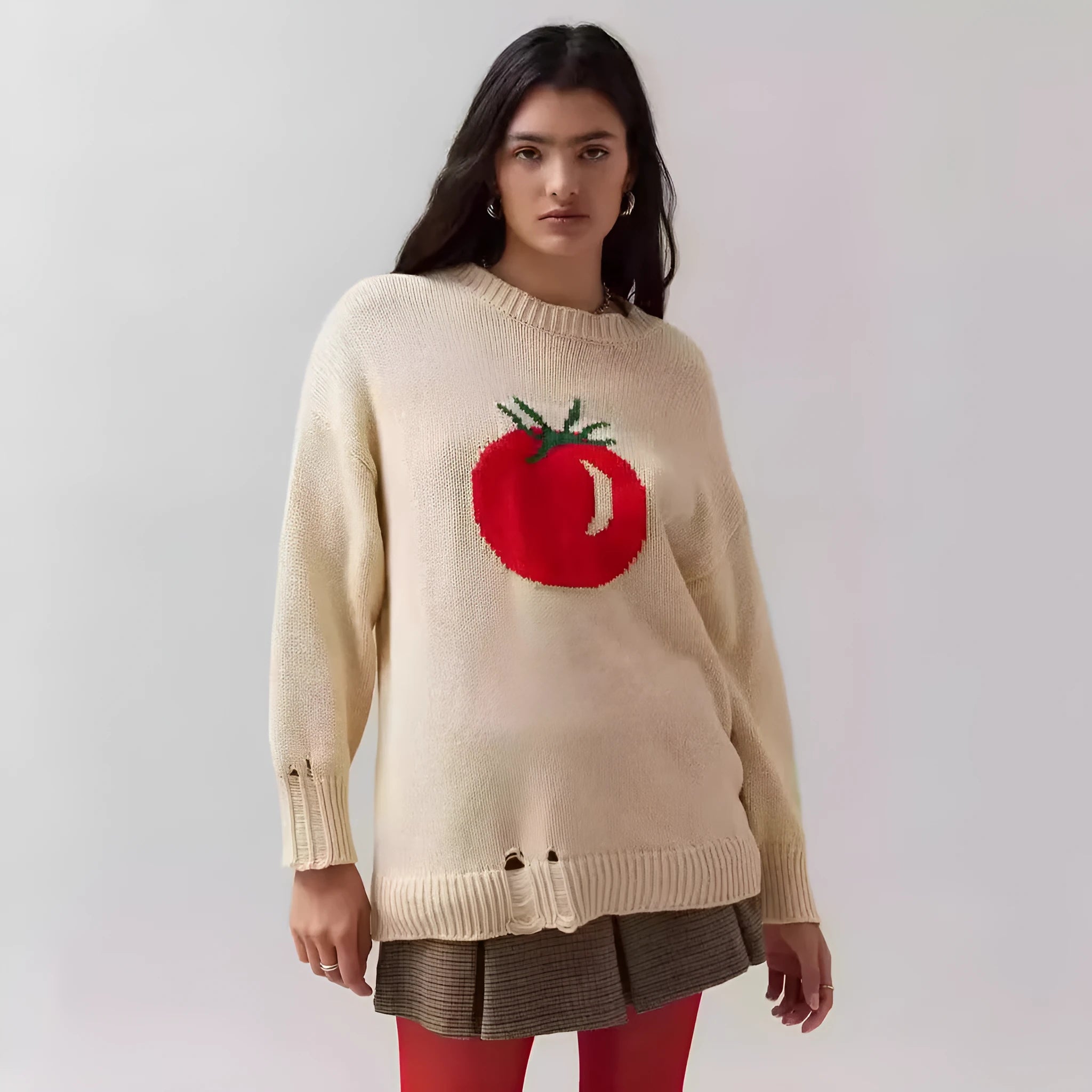 Beige women's loose-fitting acrylic jacquard pullover sweater with round neck and long sleeves.