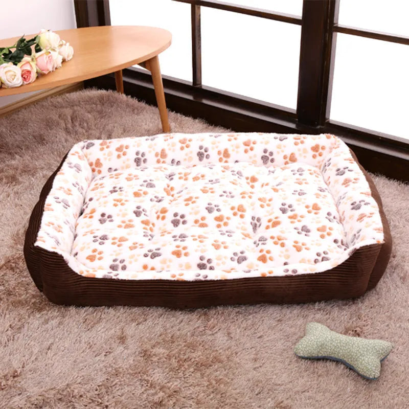 Camel coloured plush dog bed with sofa-style bolsters for small dogs, shown in Large 70x55cm size