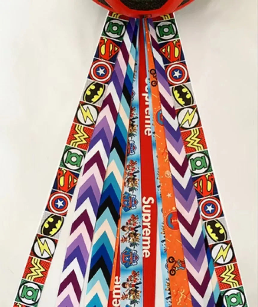 A colourful helmet streamer accessory for children's sports helmets and doll decoration.