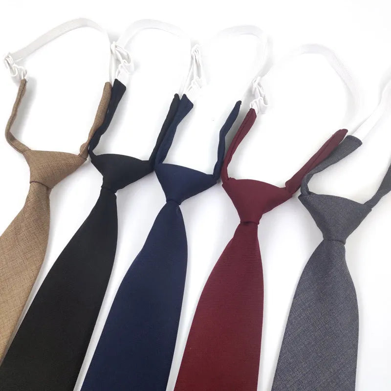 Solid navy blue men's cotton tie with arrow-type design on a white background.