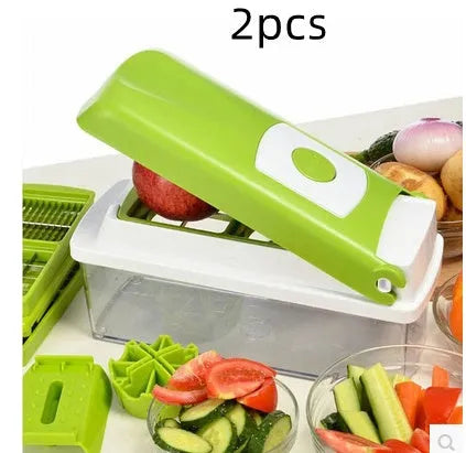 Green 12-piece manual vegetable chopper set with stainless steel blades on a kitchen counter.