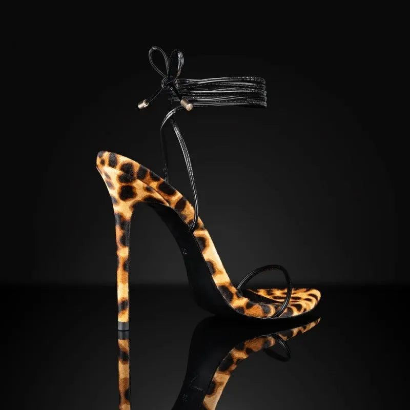 Women's leopard print pointed toe sandals with Roman lace-up ankle strap and buckle closure