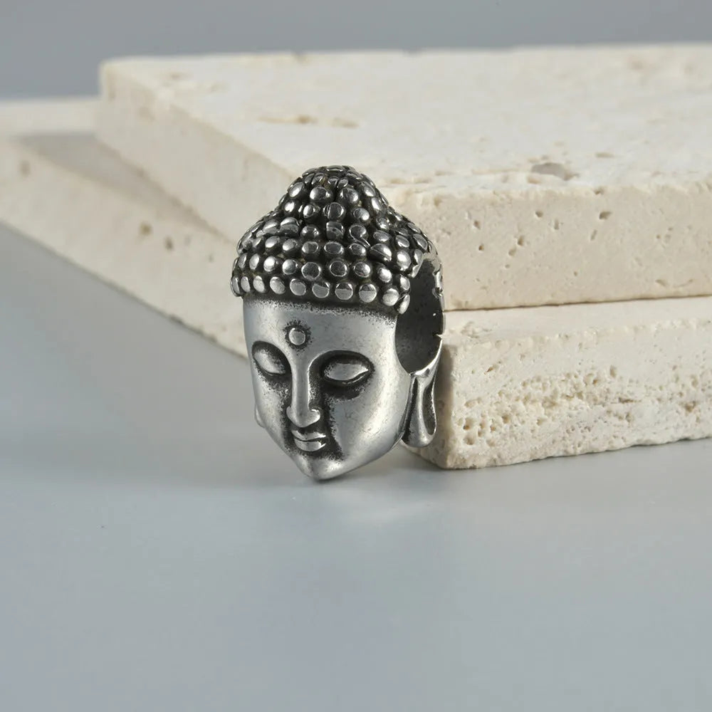 Stainless steel hollow skull Buddha earrings with geometric design in electroplated colours