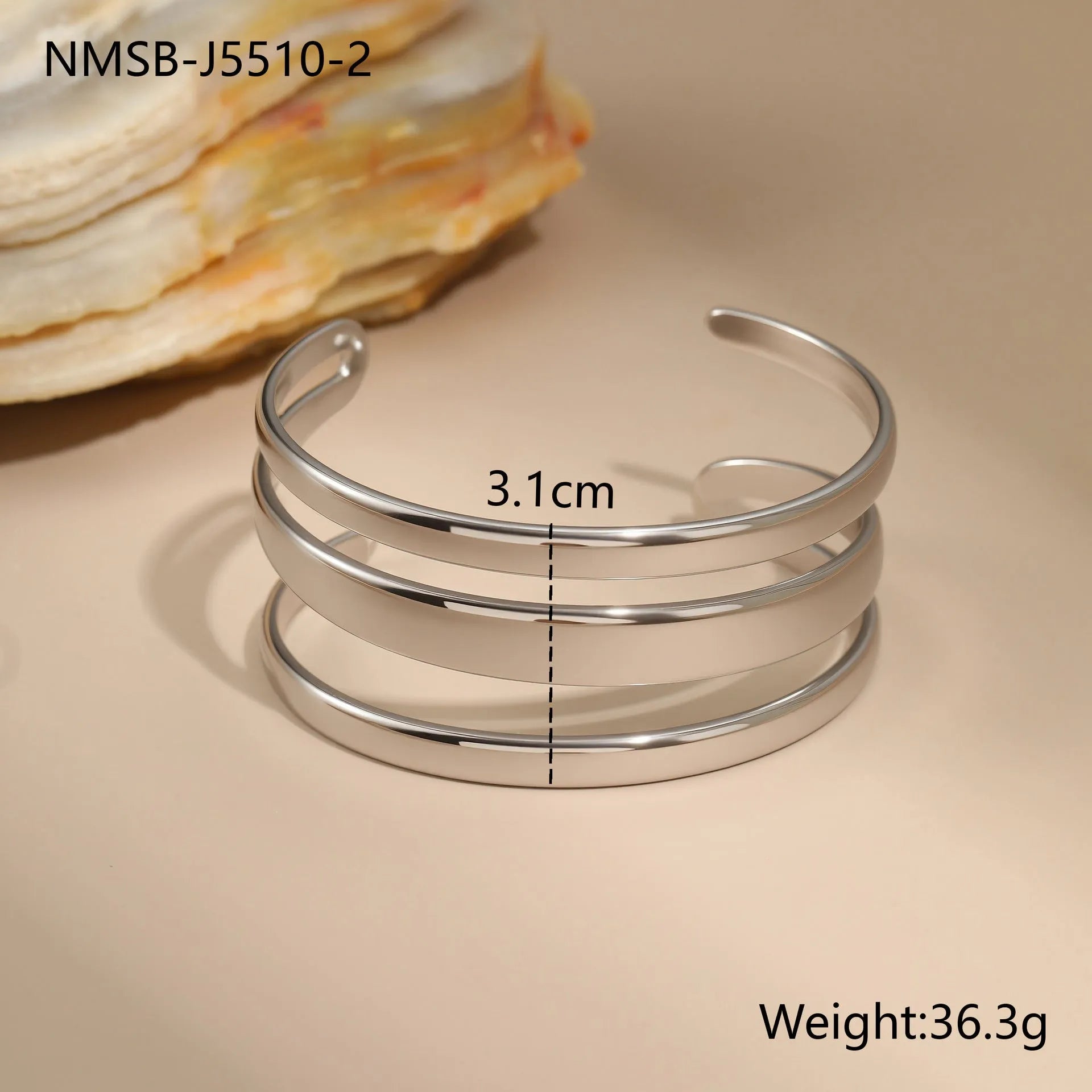Women's stainless steel bracelet with 18K gold electroplating in geometric open design with line elements
