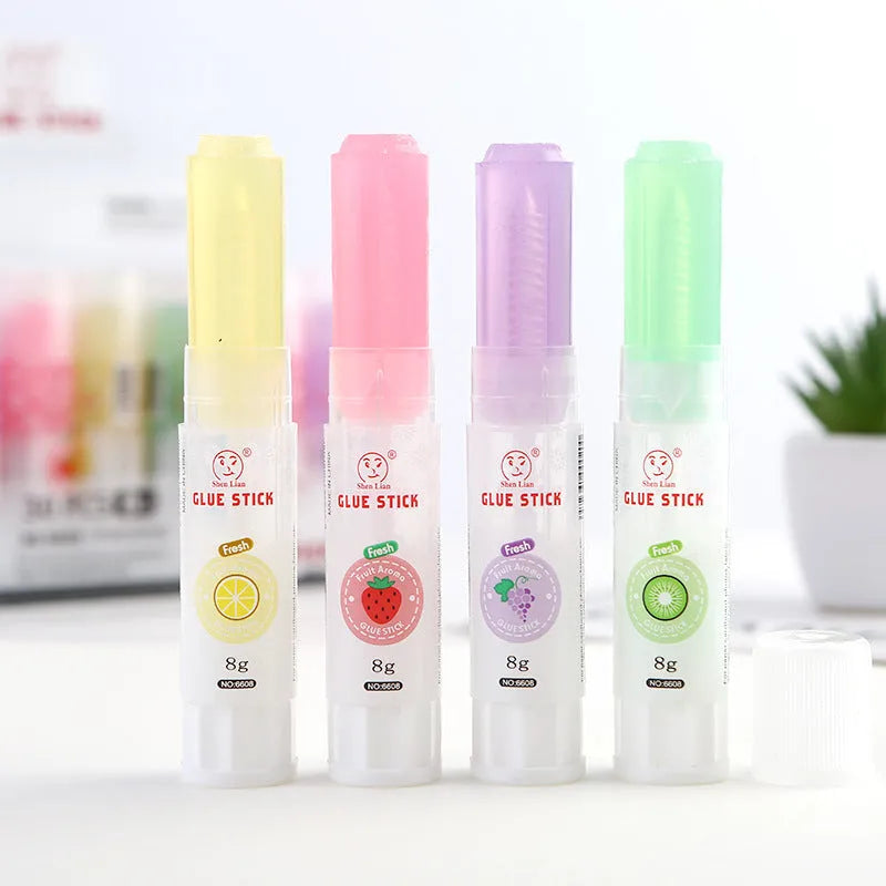 Jelly fruit fragrance solid glue stick 8.5cm long with random colour barrel on white background