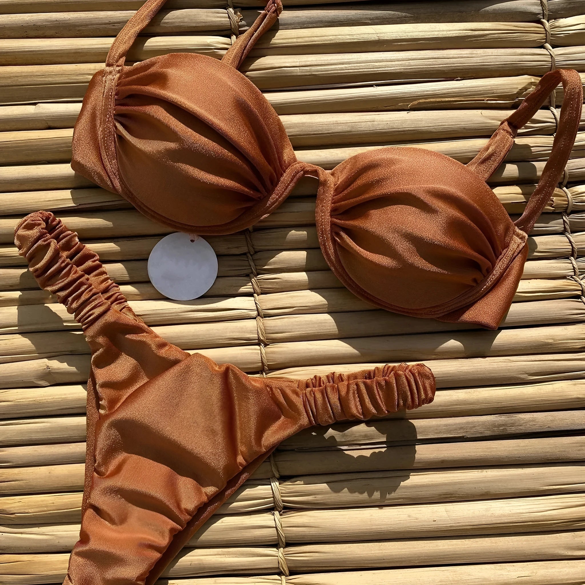 Women's black underwire bikini swimsuit set with brief bottom on a mannequin.