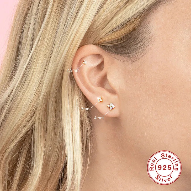 S925 sterling silver stud earrings with a petal-shaped crystal flower in gold or platinum finish.