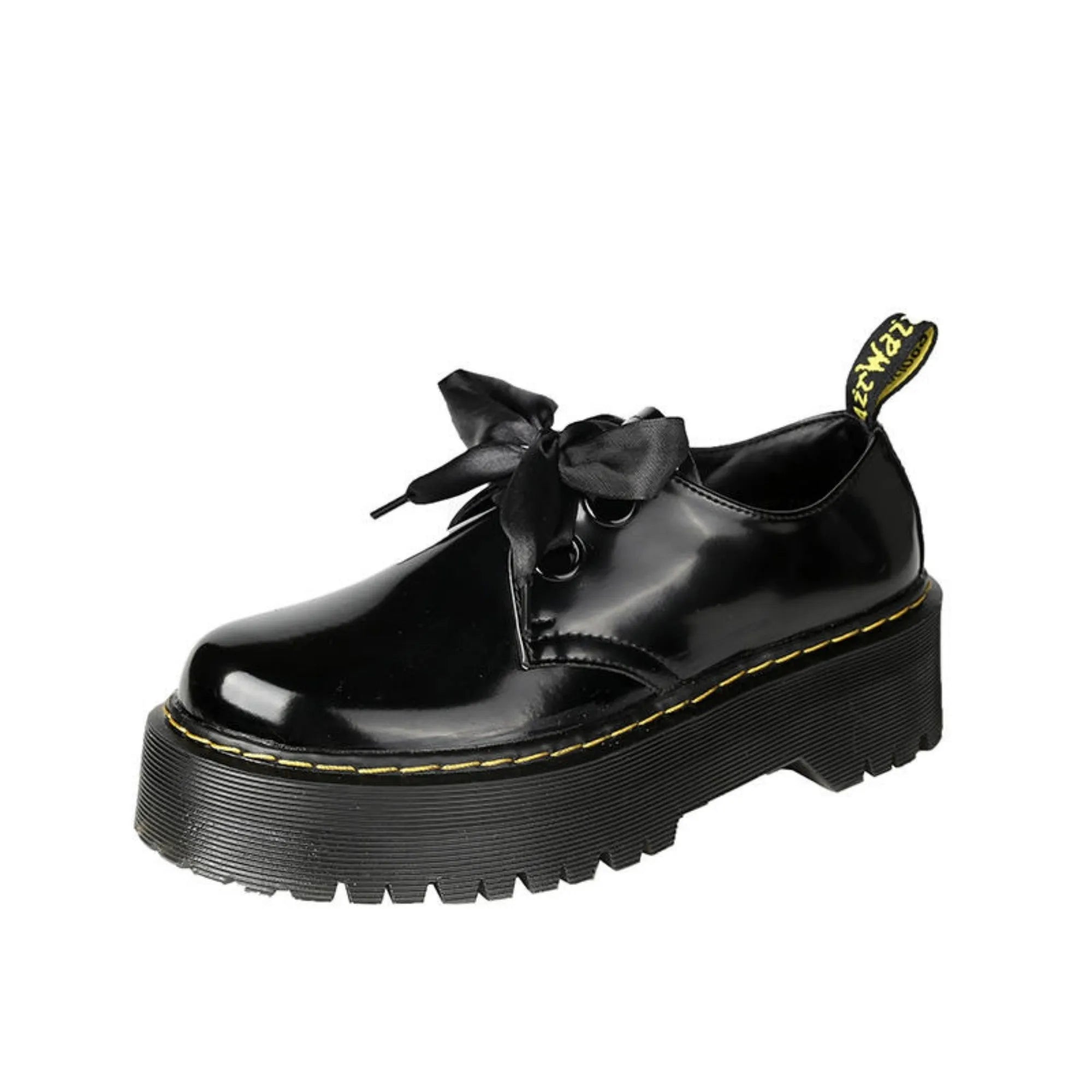 Women's black leather shoes with thick soles, cross straps, and ribbon lacing shown from side view