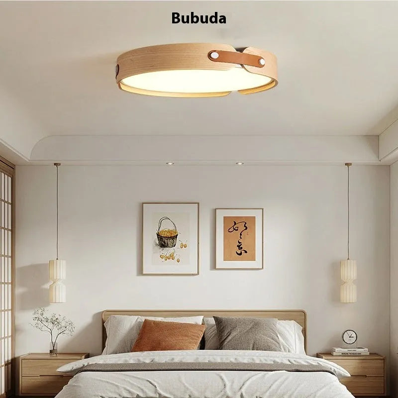 Japanese style wooden ceiling lamp with a round PMMA lampshade in warm light colour.