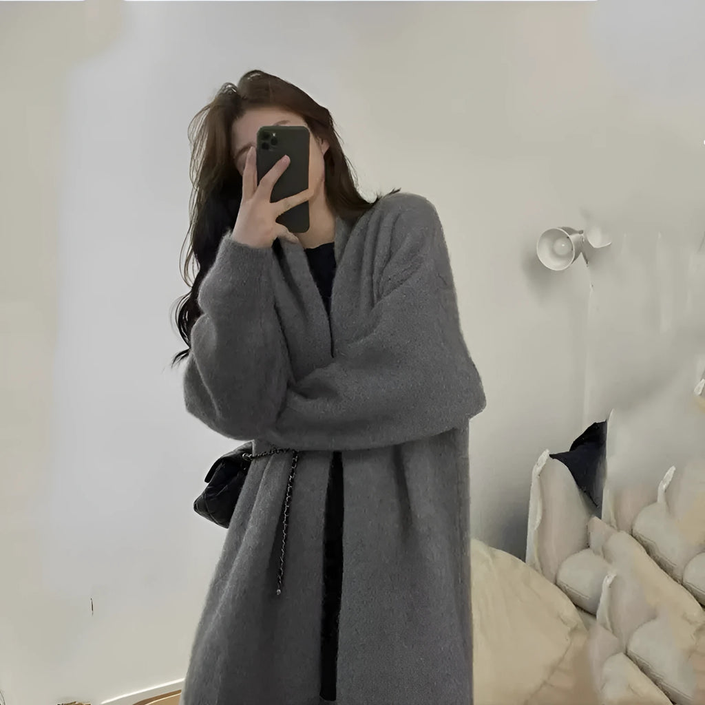 Women's loose knitted chenille cardigan in dark grey showing 3D pattern texture
