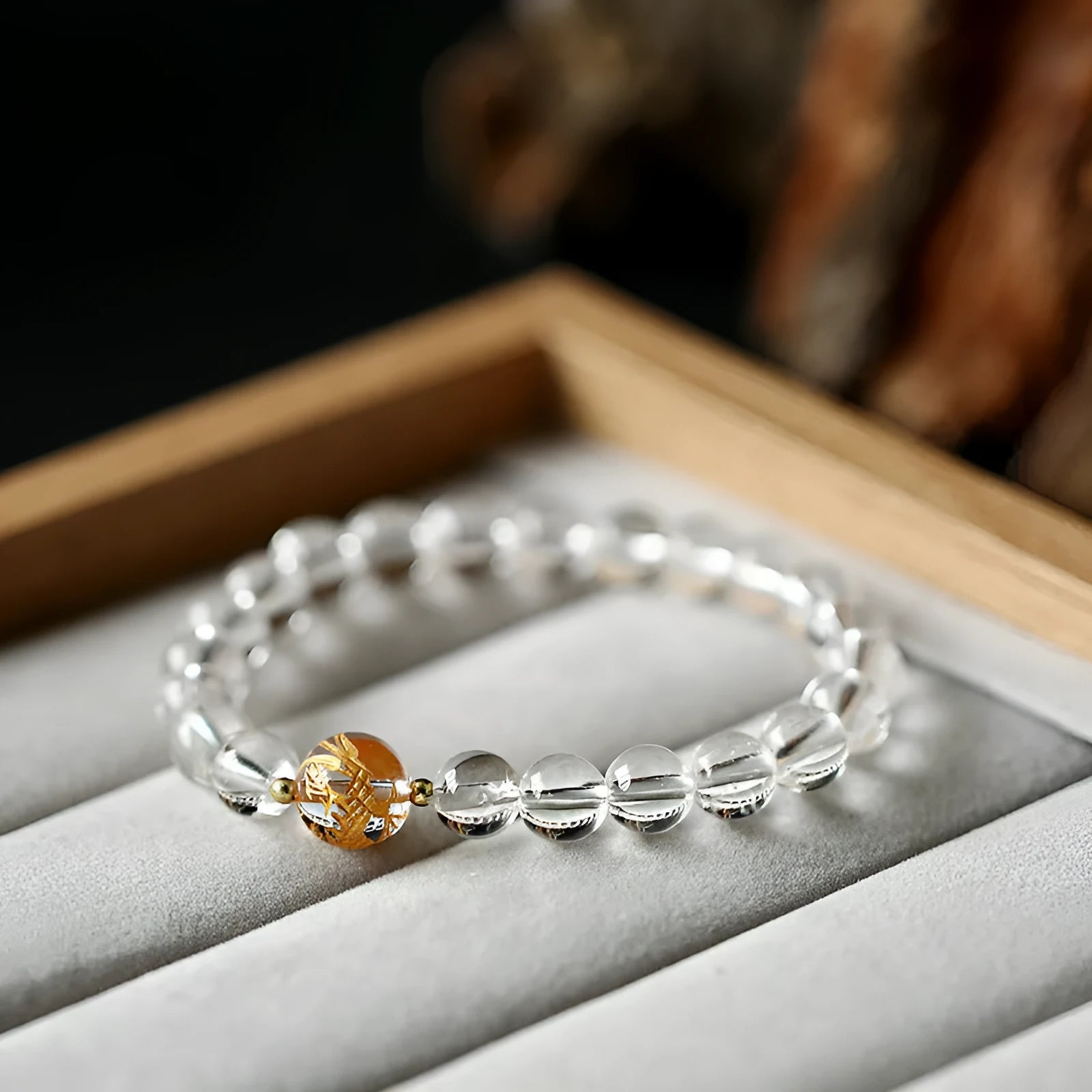 Geometric obsidian and white crystal beaded bracelet with golden dragon charm on adjustable band