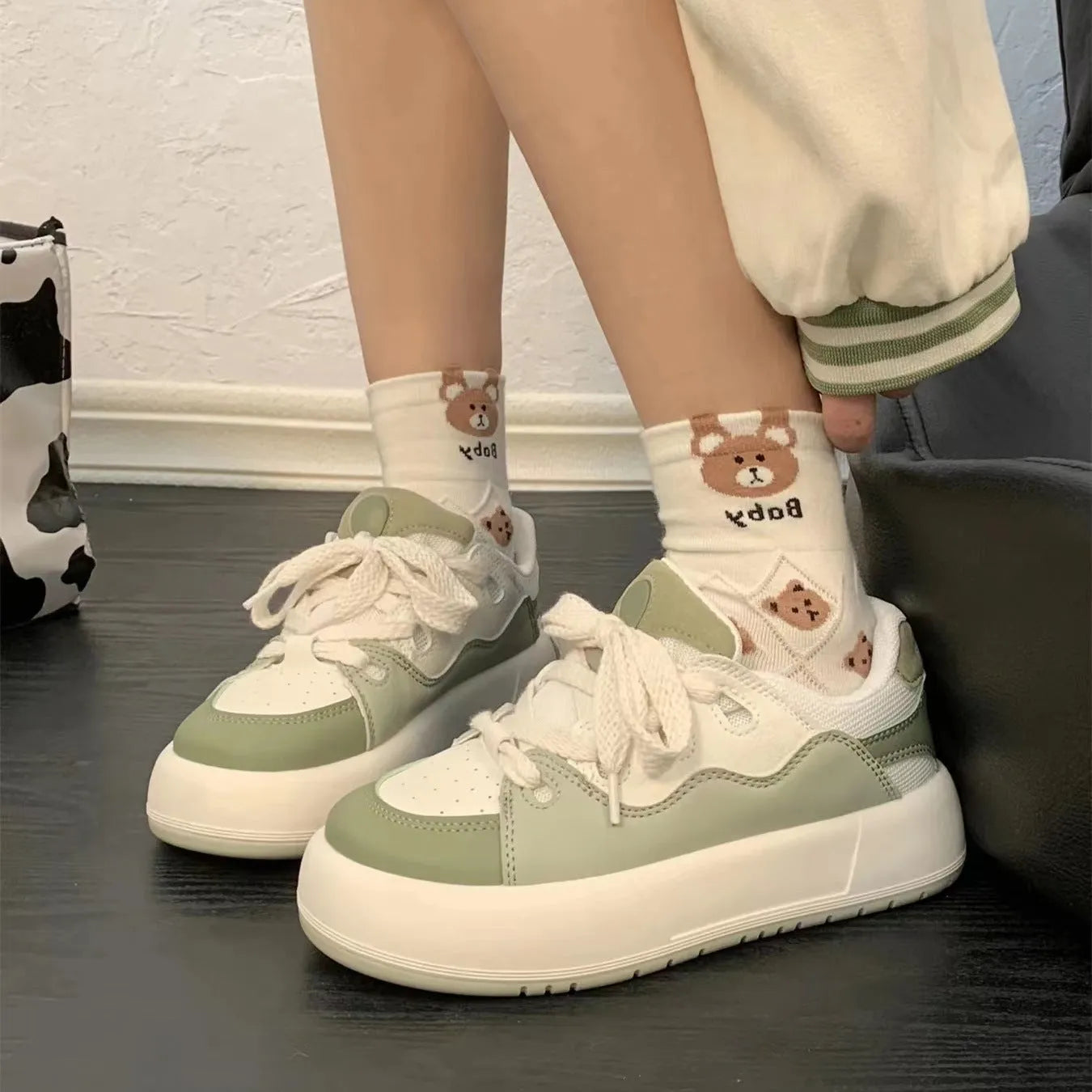 Women's green casual shoes with mesh upper, flat heel, and round toe design