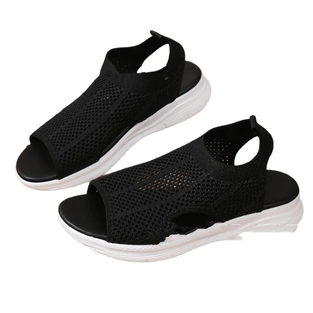 Women's black platform sports sandals with a flat toe and mesh lining on a rubber sole.