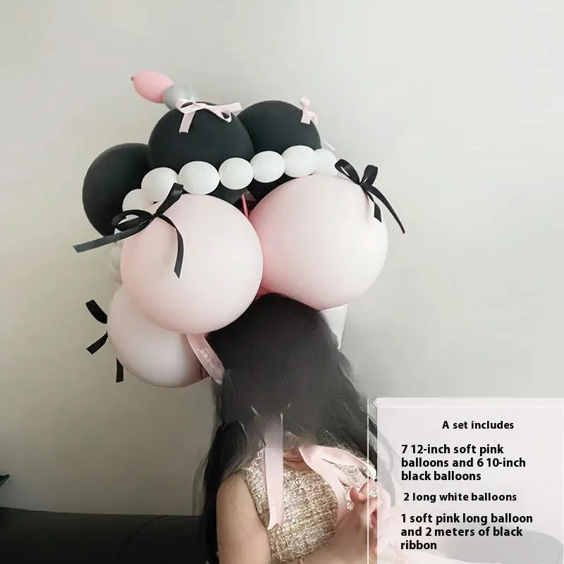 Finished round balloon bouquet decoration for cake table centrepiece.