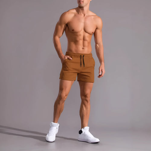 Three pairs of men's solid colour drawstring shorts in a pack, shown in black, khaki, and light brown.
