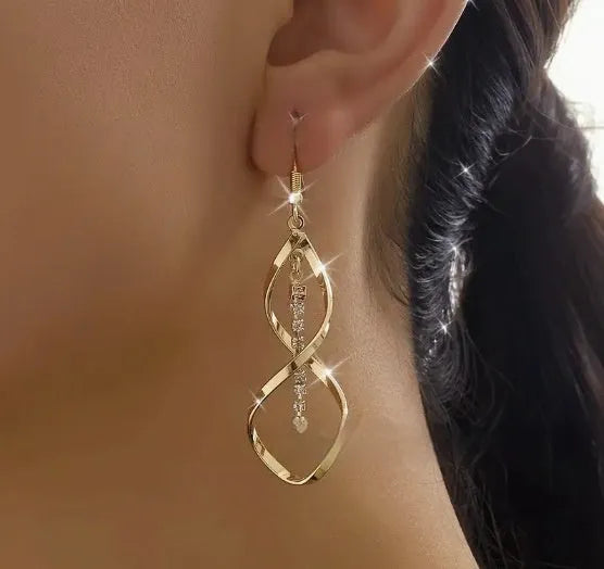 Gold spiral design alloy earrings with geometric ellipse shape