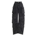 Blue tie-dyed high waist wide leg denim trousers on a woman, showing multiple pockets and street hipster style.