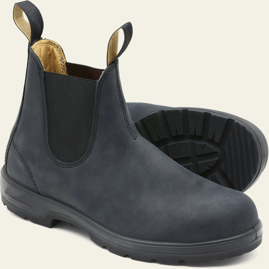 Vintage brown unisex Chelsea boots with a frosted finish, round toe, and low horseshoe heel on a wooden floor.