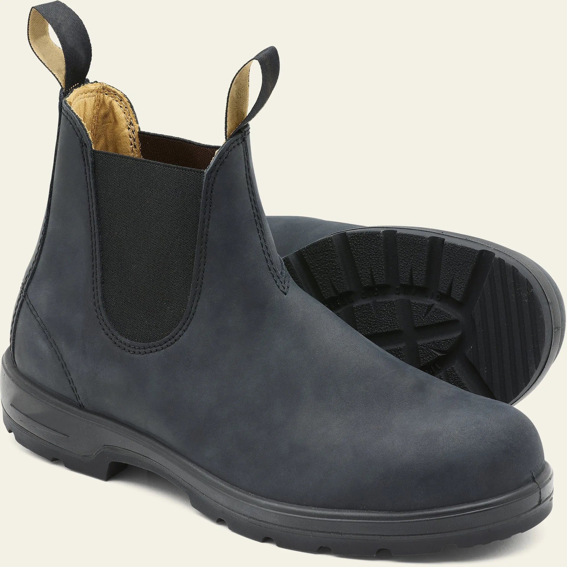Vintage brown unisex Chelsea boots with a frosted finish, round toe, and low horseshoe heel on a wooden floor.