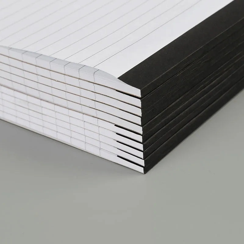 A4 tearable notebook with grid-lined ivory pages and wireless adhesive binding, shown in both A4 and A5 sizes