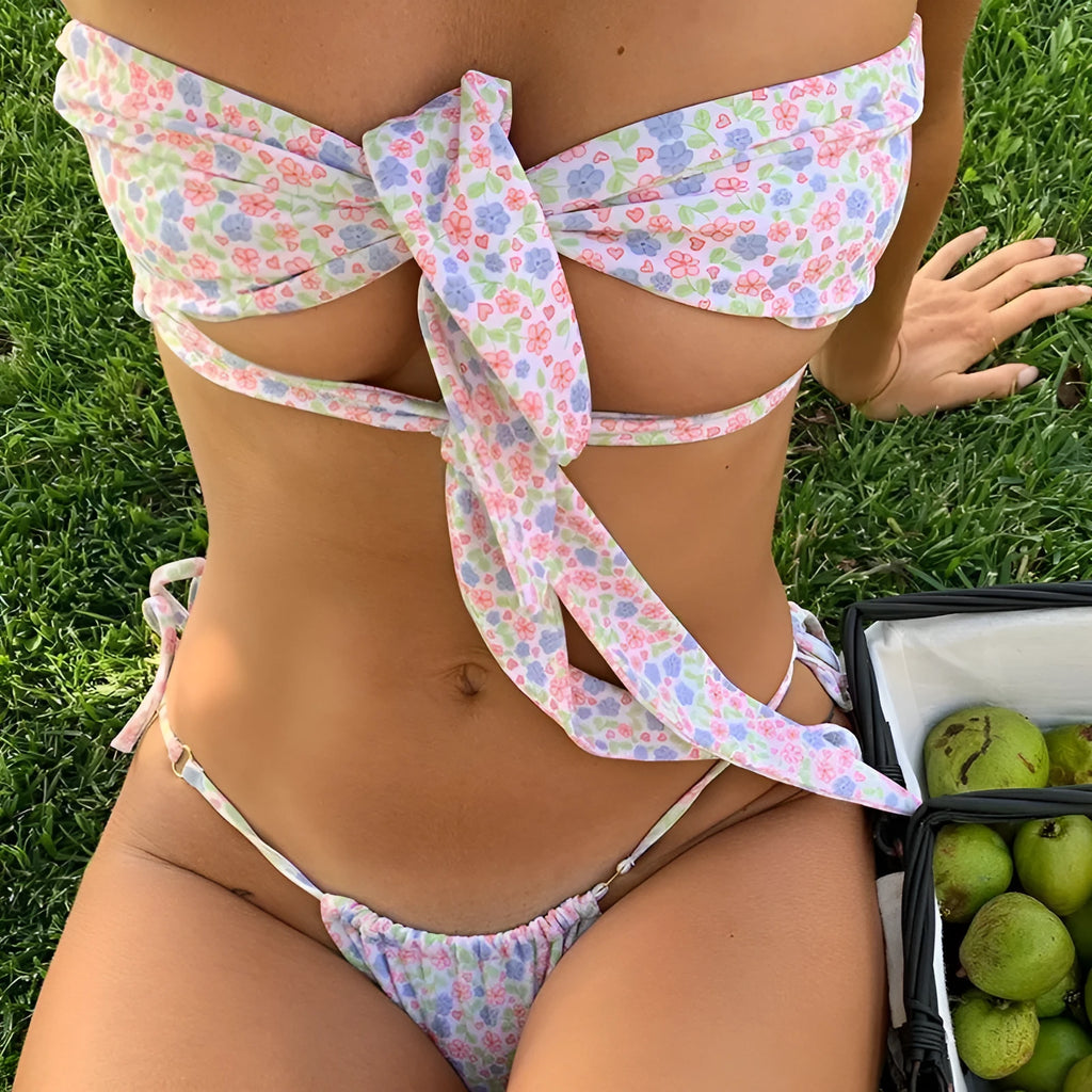 Women's lace-up front swimsuit with floral print and built-in chest pad