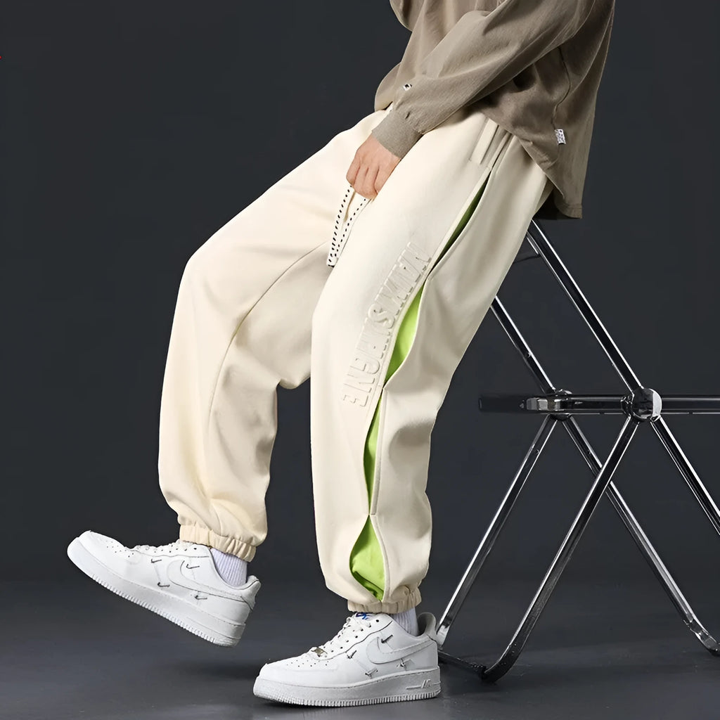 Men's loose fit ankle banded trousers with stitching detail in various colours