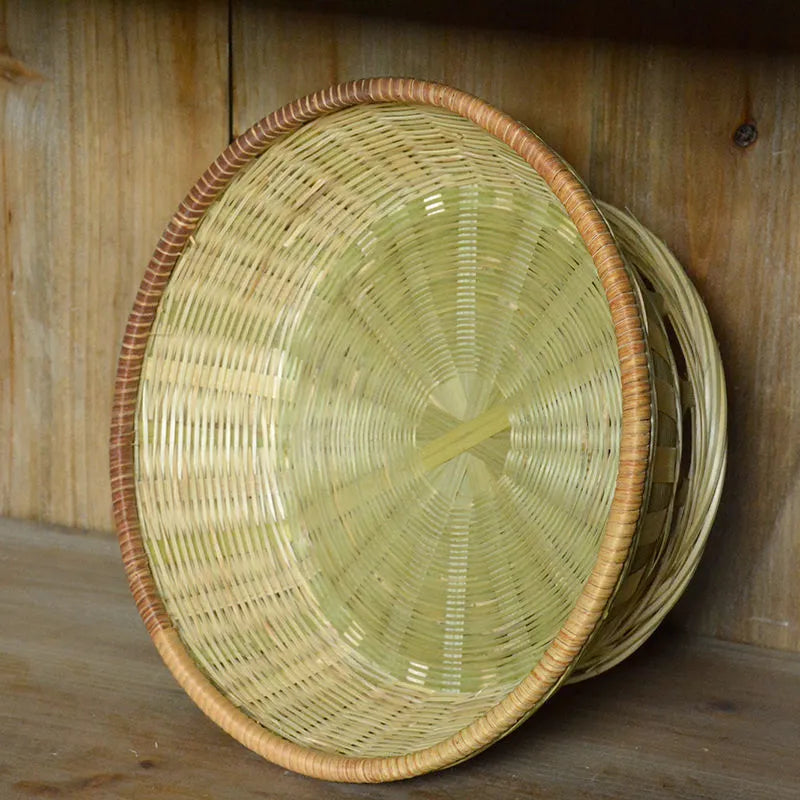 Handmade natural bamboo storage basket set showing three different sizes for household organisation