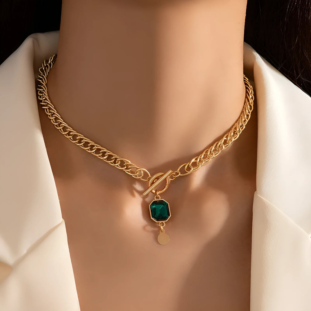 Gold titanium steel necklace with geometric emerald zircon pendant on Cuban link chain