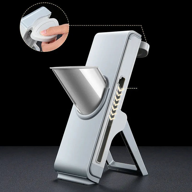 Hand-crank vegetable cutter in simple grey with three blades and fresh-keeping box on a kitchen counter