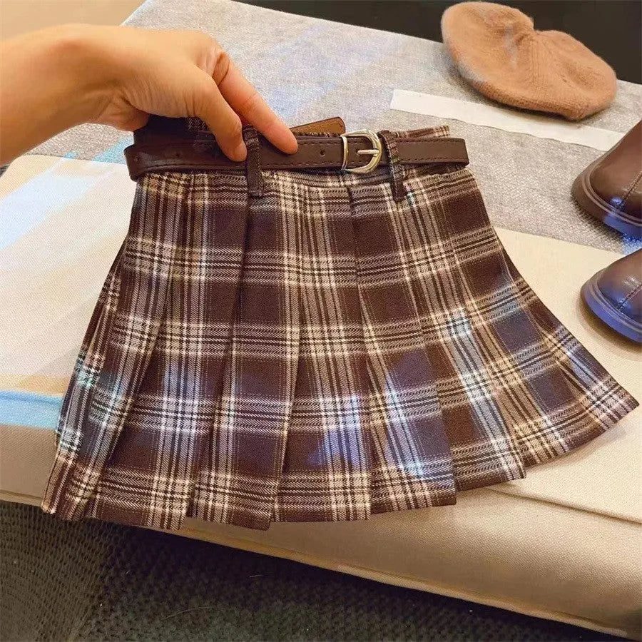 Girls plaid pleated A-line skirt in cotton blend fabric on hanger.