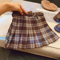 Girls plaid pleated A-line skirt in cotton blend fabric on hanger.