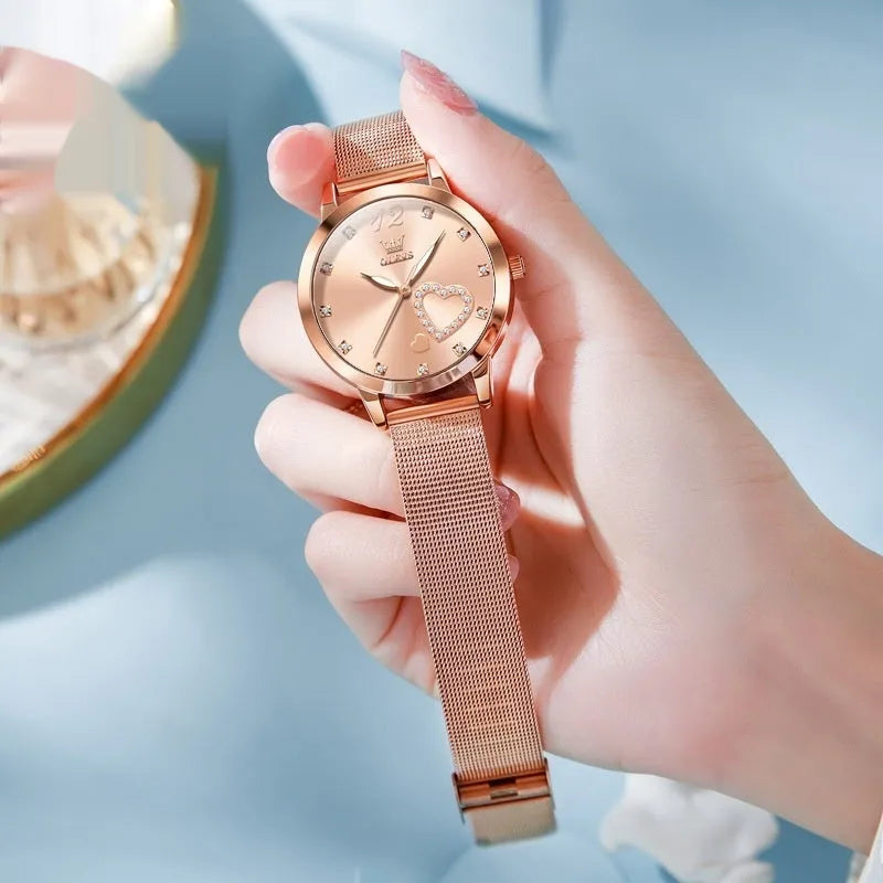 Women's mesh strap watch with rose shell casing showing six face colour options