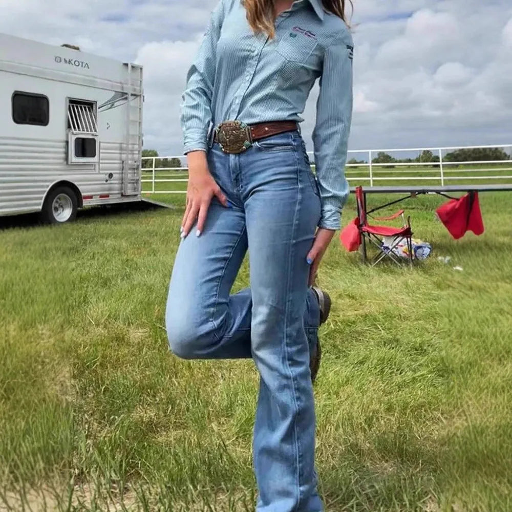 Slim fit mid-waist jeans with slight flare and embroidery detailing on blue denim