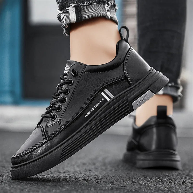 Men's white and black low-top skateboard shoes with elastic band fastening and rubber sole.