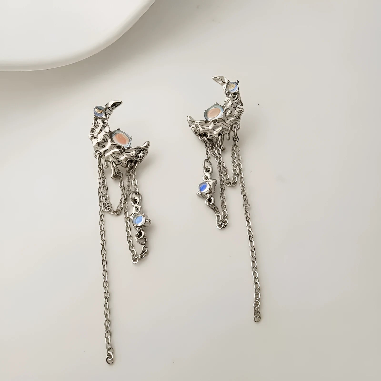 Pair of S925 silver needle moon earrings with long fringe and irregular polka dot detailing in silver tone
