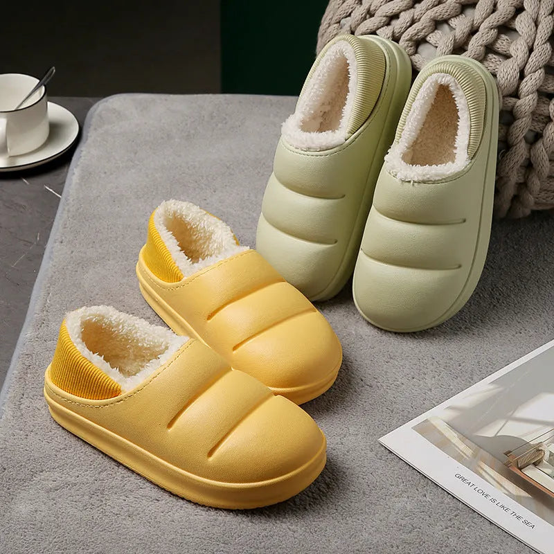 Yellow and green waterproof EVA winter house slippers with plush lining and non-slip sole.