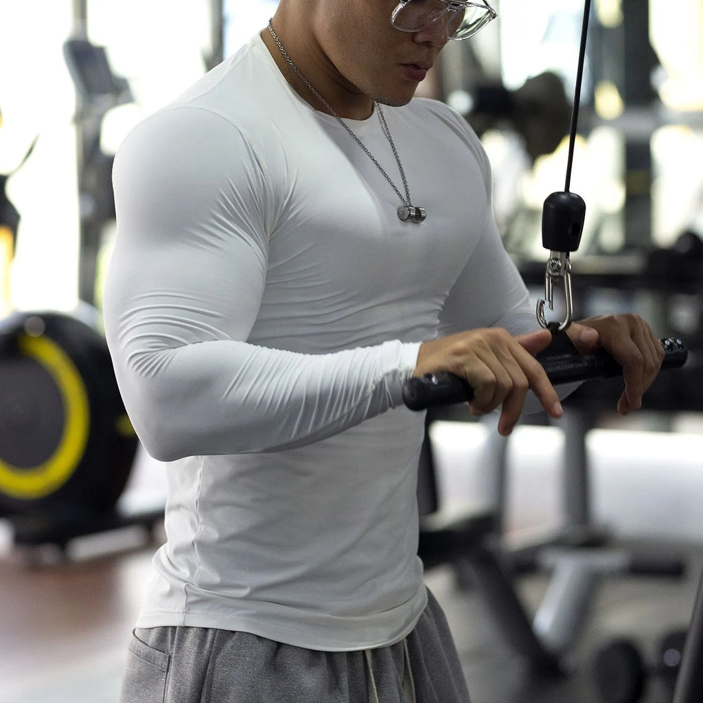 Men's black long-sleeved slim fit fitness tights for running and gym workouts