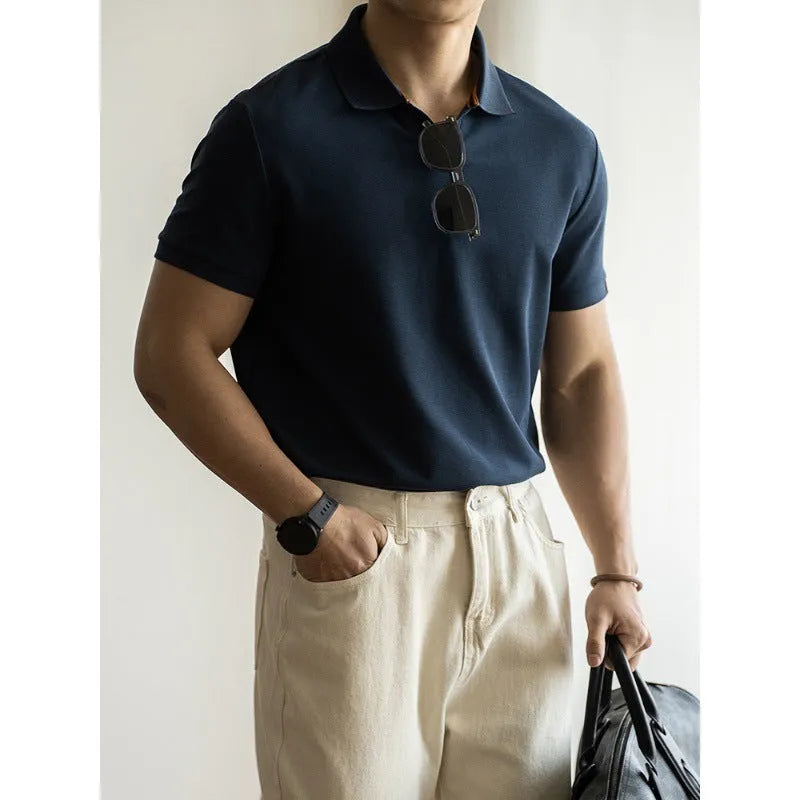 American-style short-sleeve polo shirt in blue, shown on a model.