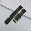 Oxford cloth canvas watch strap in army green colour showing textured fabric and buckle.