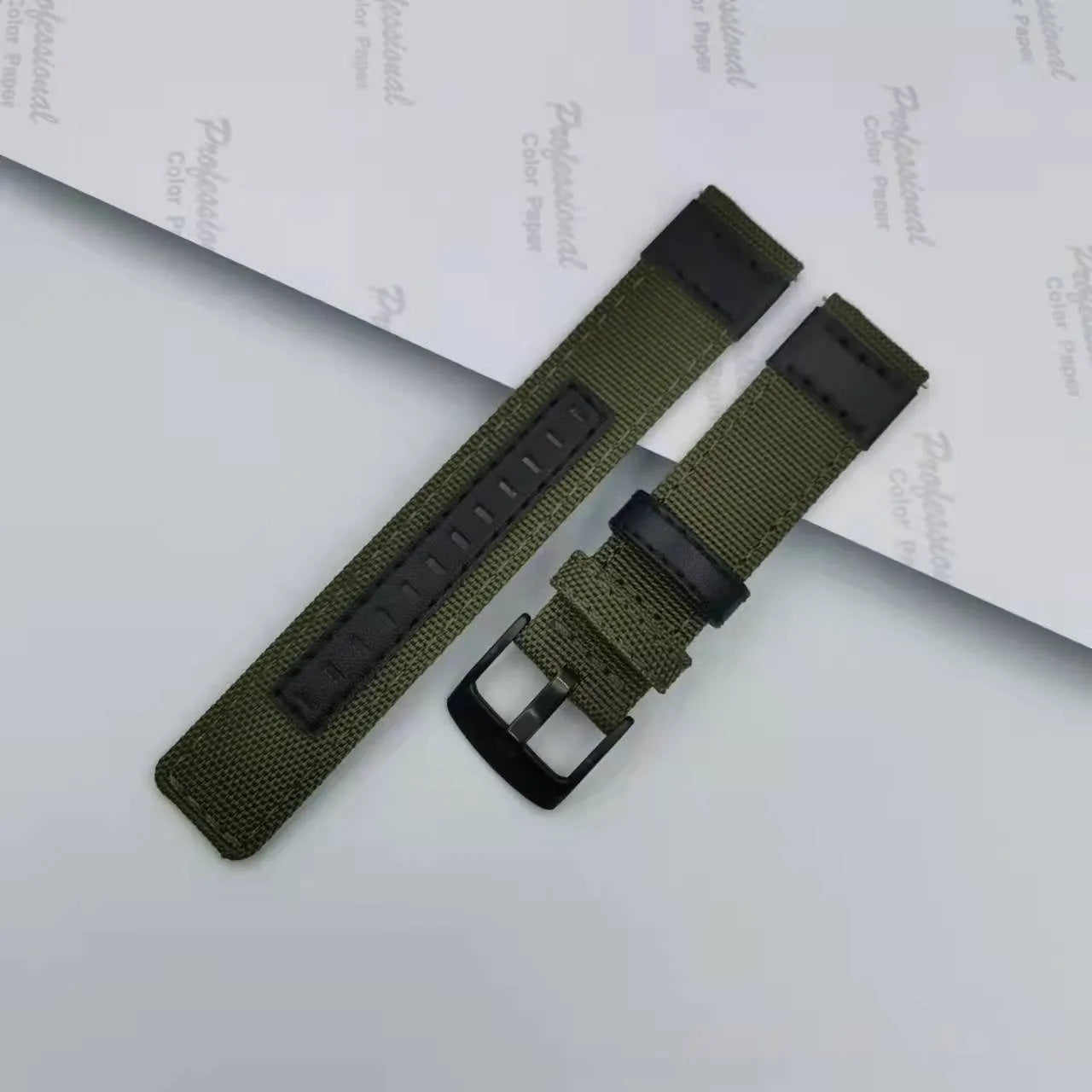 Oxford cloth canvas watch strap in army green colour showing textured fabric and buckle.