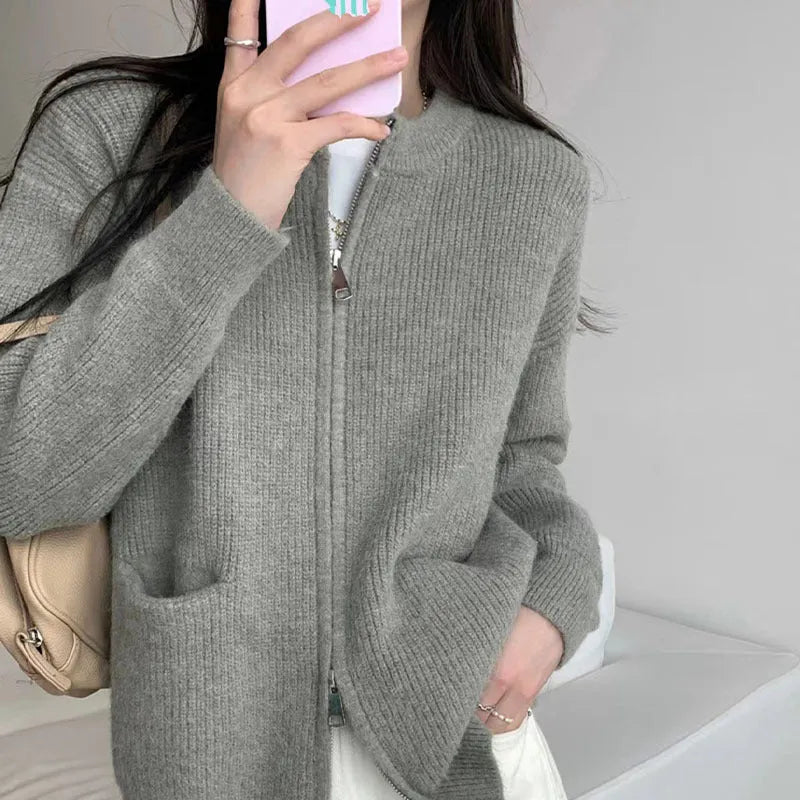 Beige viscose knit long sleeve cardigan sweater coat on a hanger