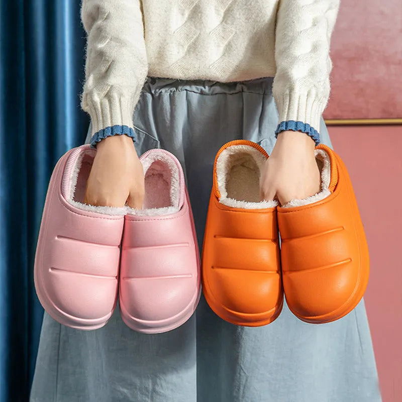 Yellow and green waterproof EVA winter house slippers with plush lining and non-slip sole.